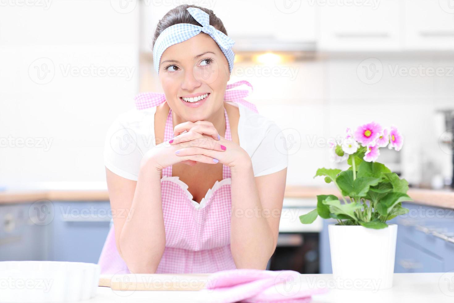 Perfect housewife in the kitchen photo