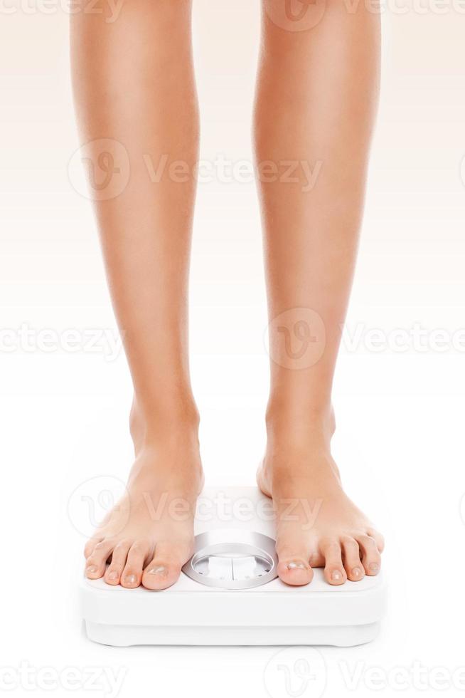 Legs on bathroom scales photo