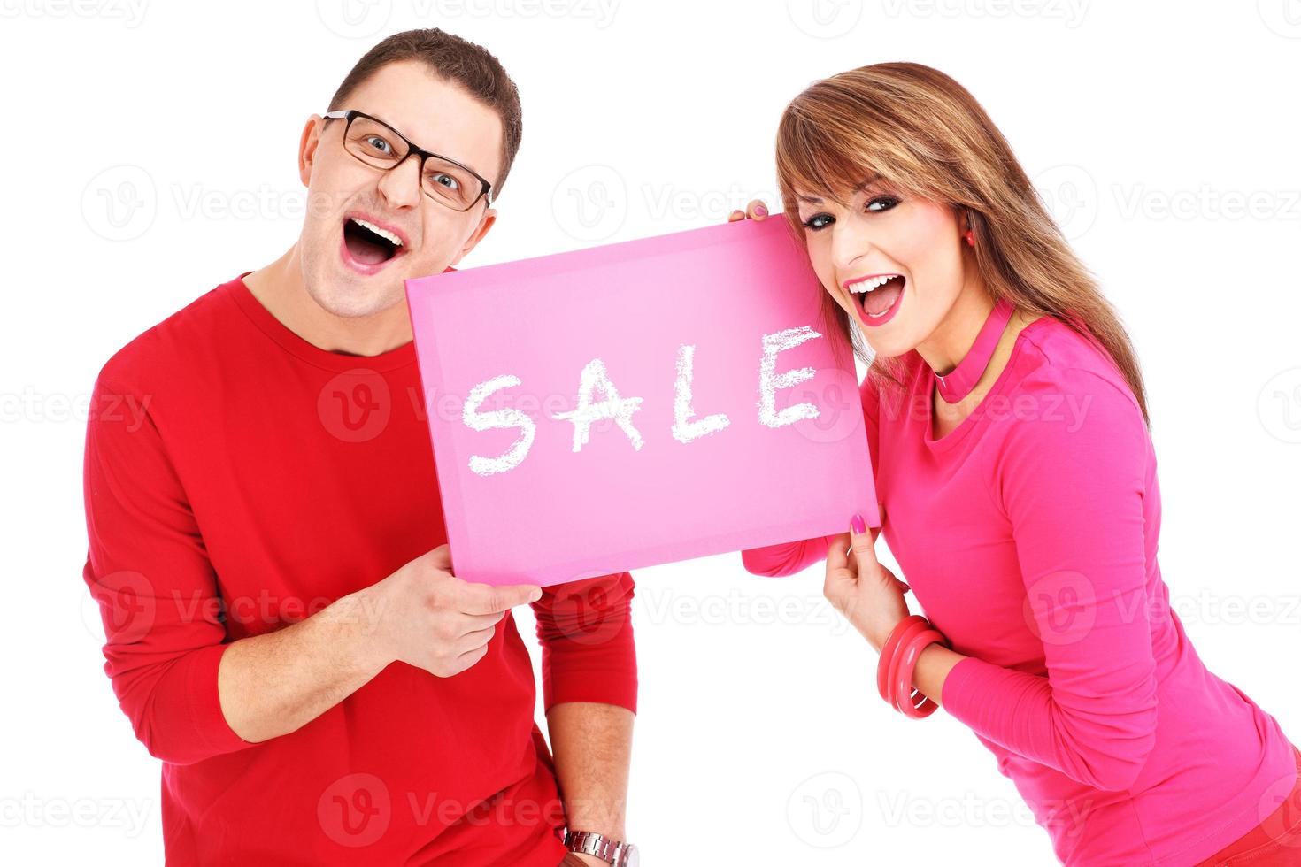 Couple with sale board photo