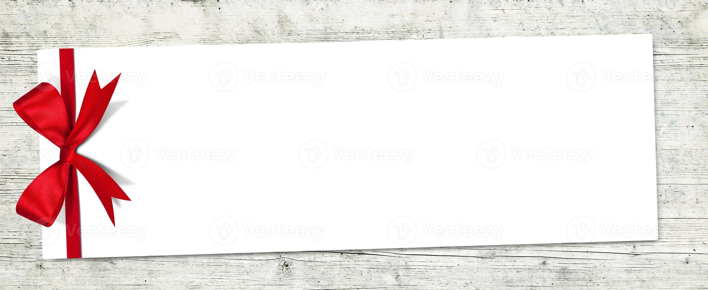 Gift card note with ribbon on isolated background photo