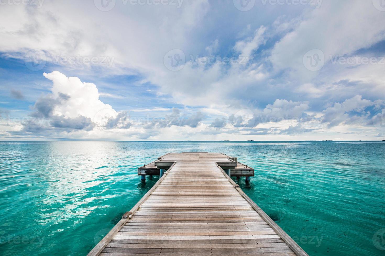 Jetty leads to the sea. Find your way and purpose in life. Wooden road and way to the future and new discoveries. Freedom, success, start concept. Rest, travel and enjoy life, relax view and calmness photo