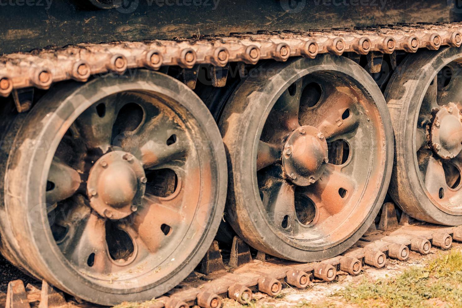 Detail shot with old tank tracks and wheels photo