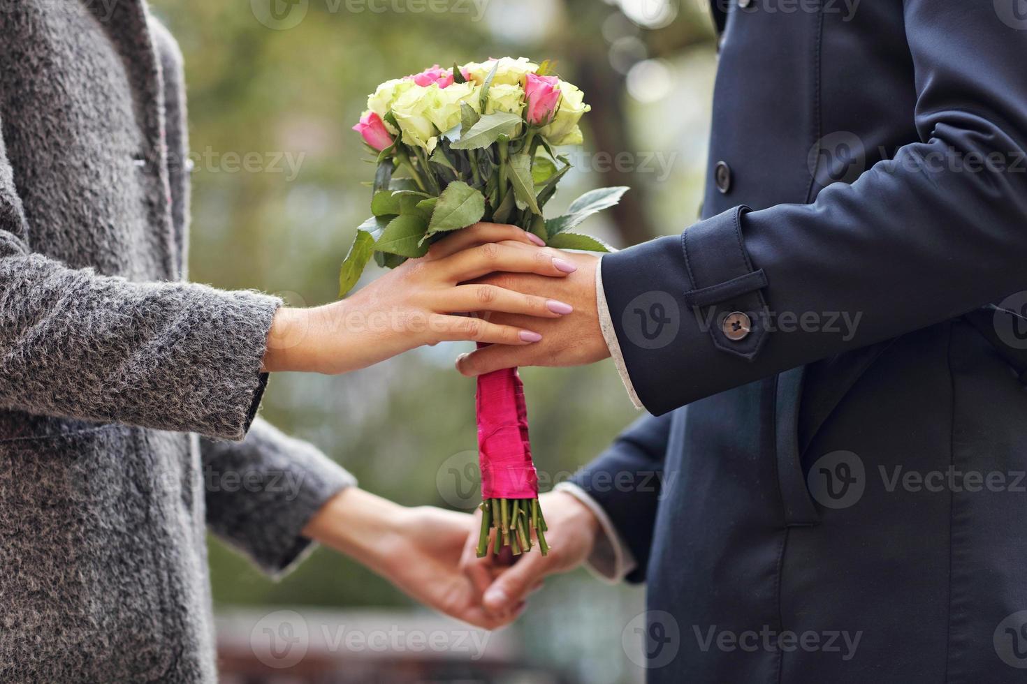 Young couple with flowers photo