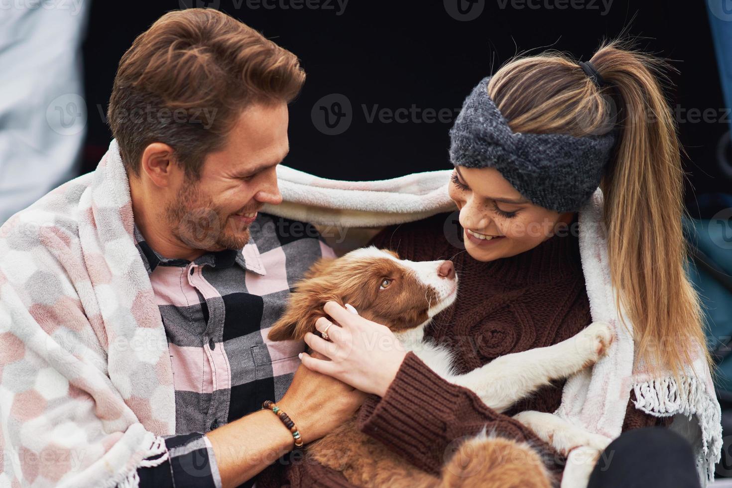Young nice couple having fun on camping photo