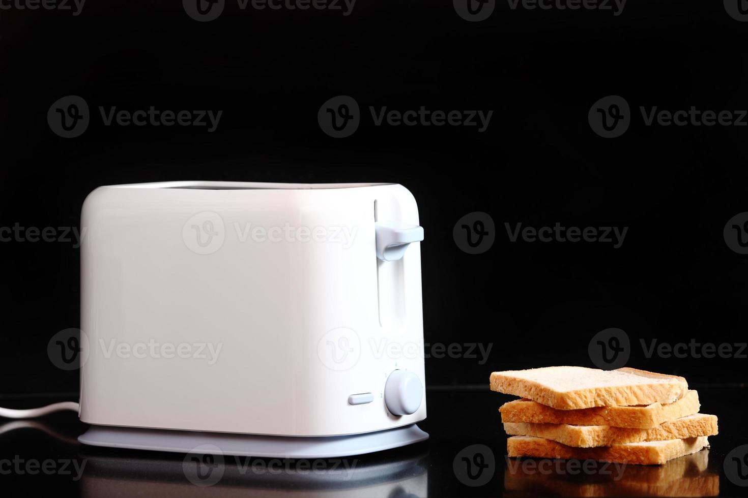 Toasted bread and toaster photo