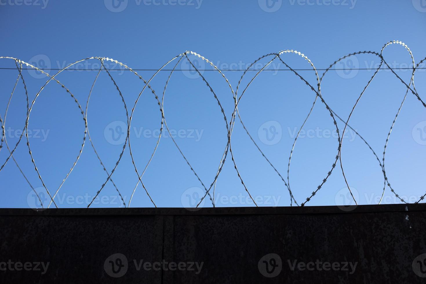 Barbed wire fence. Details of industrial area. photo