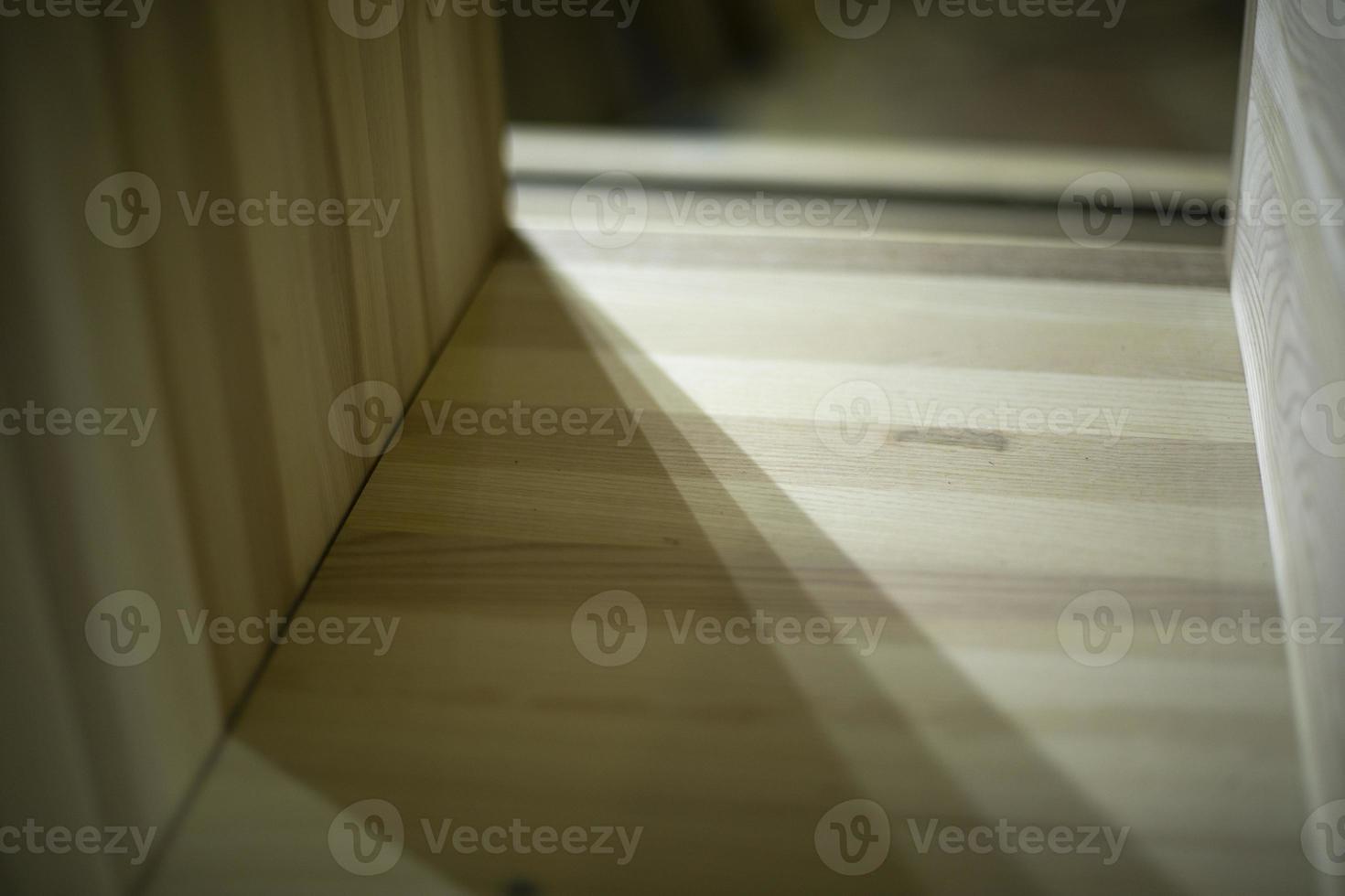 Boards on table. Furniture details. Blanks made of wood. photo