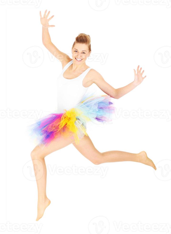 Jumping woman in a colourful skirt photo