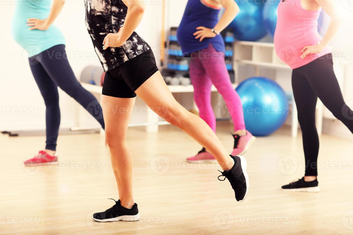 Group of pregnant women during fitness class photo