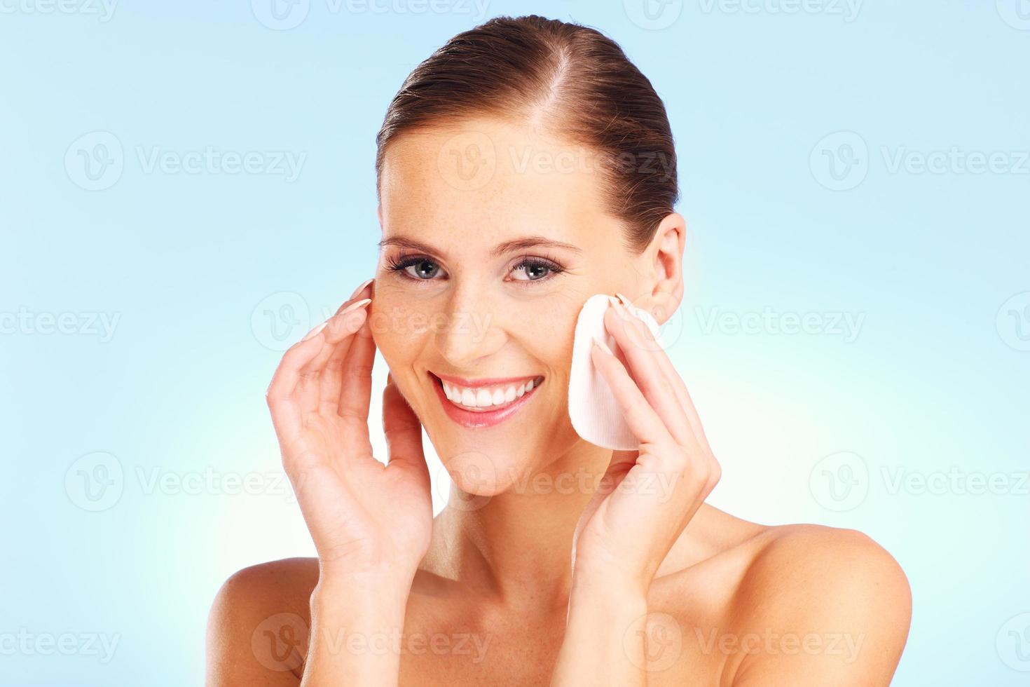 Portrait of a sensual woman removing makeup photo