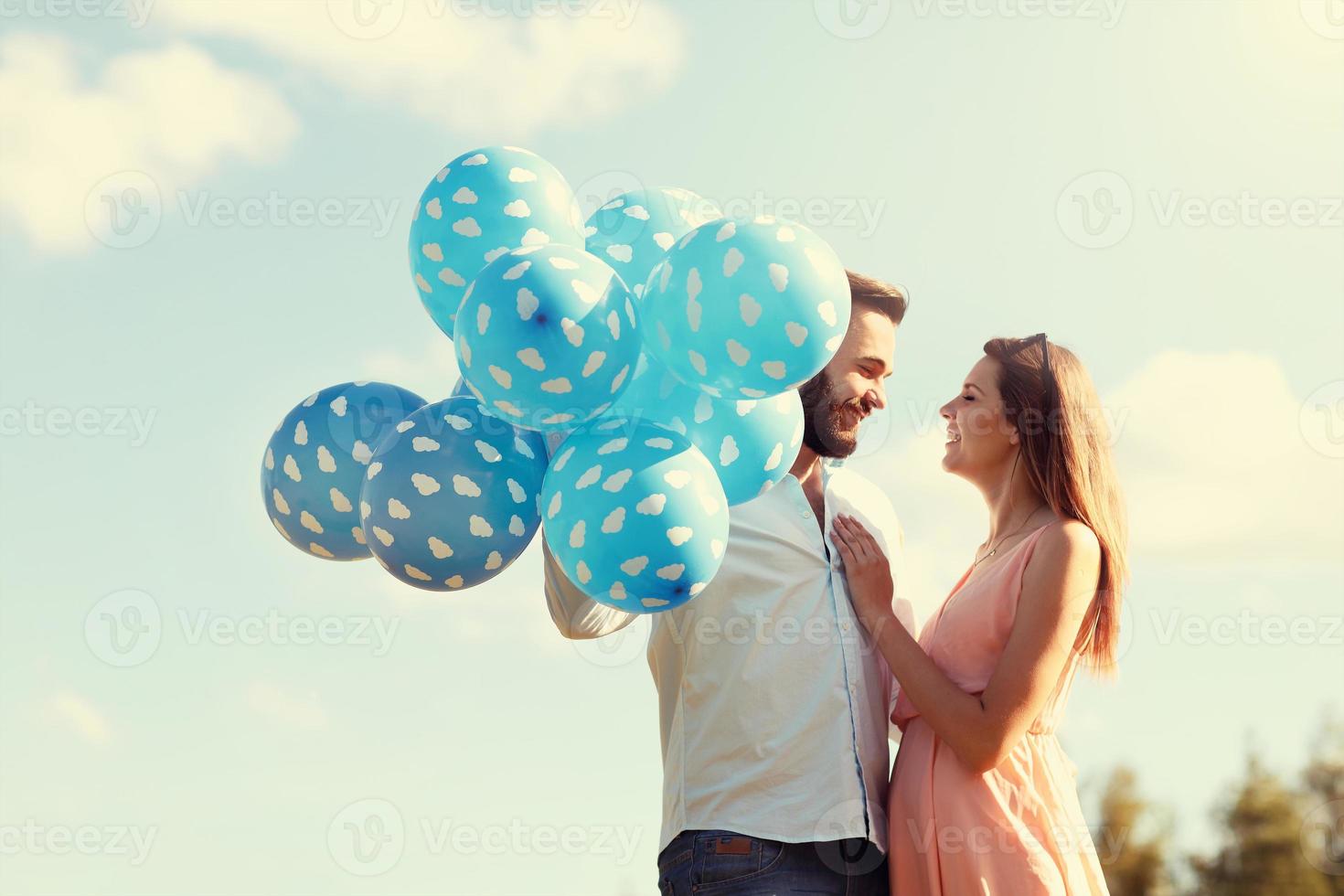 Romantic couple with baloons photo