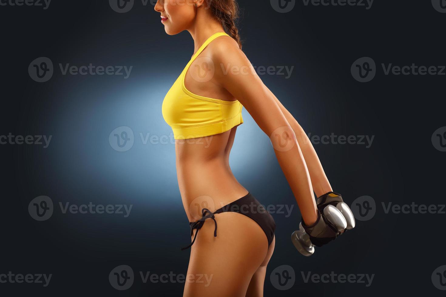 Woman lifting dumbells photo