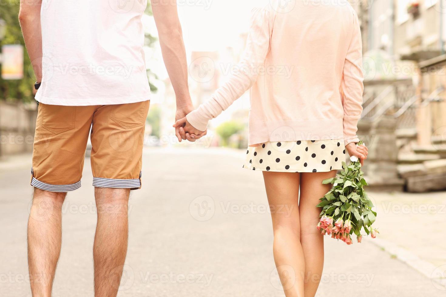 Romantic couple walking in the city photo