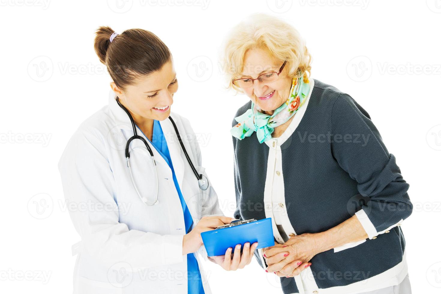 Doctor Showing Medical Documents To Senior Patient photo