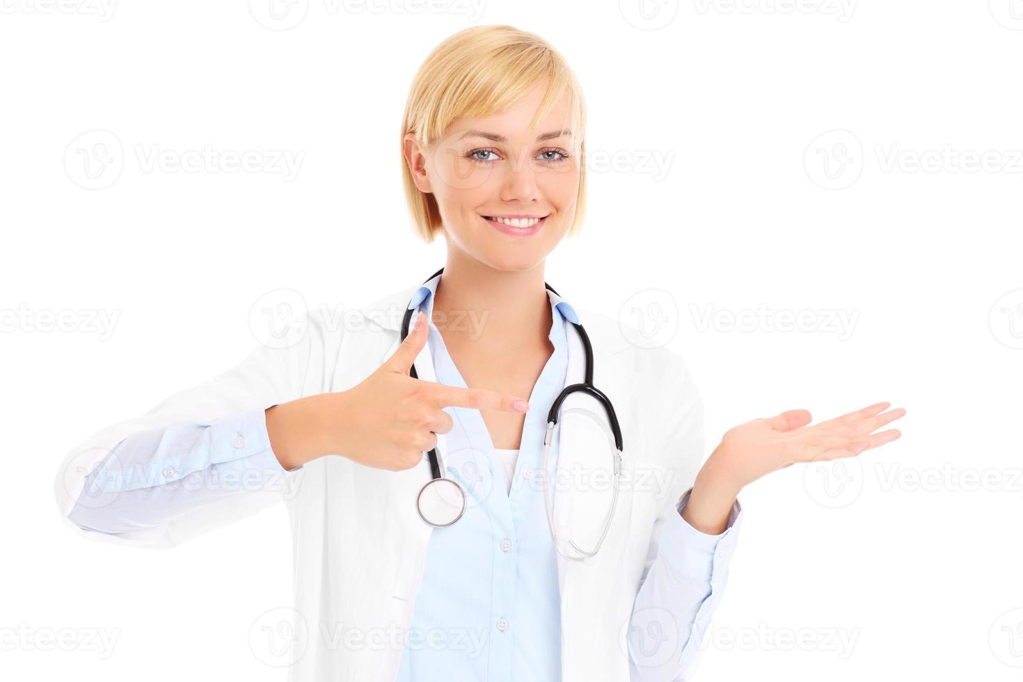 Doctor showing over white background photo