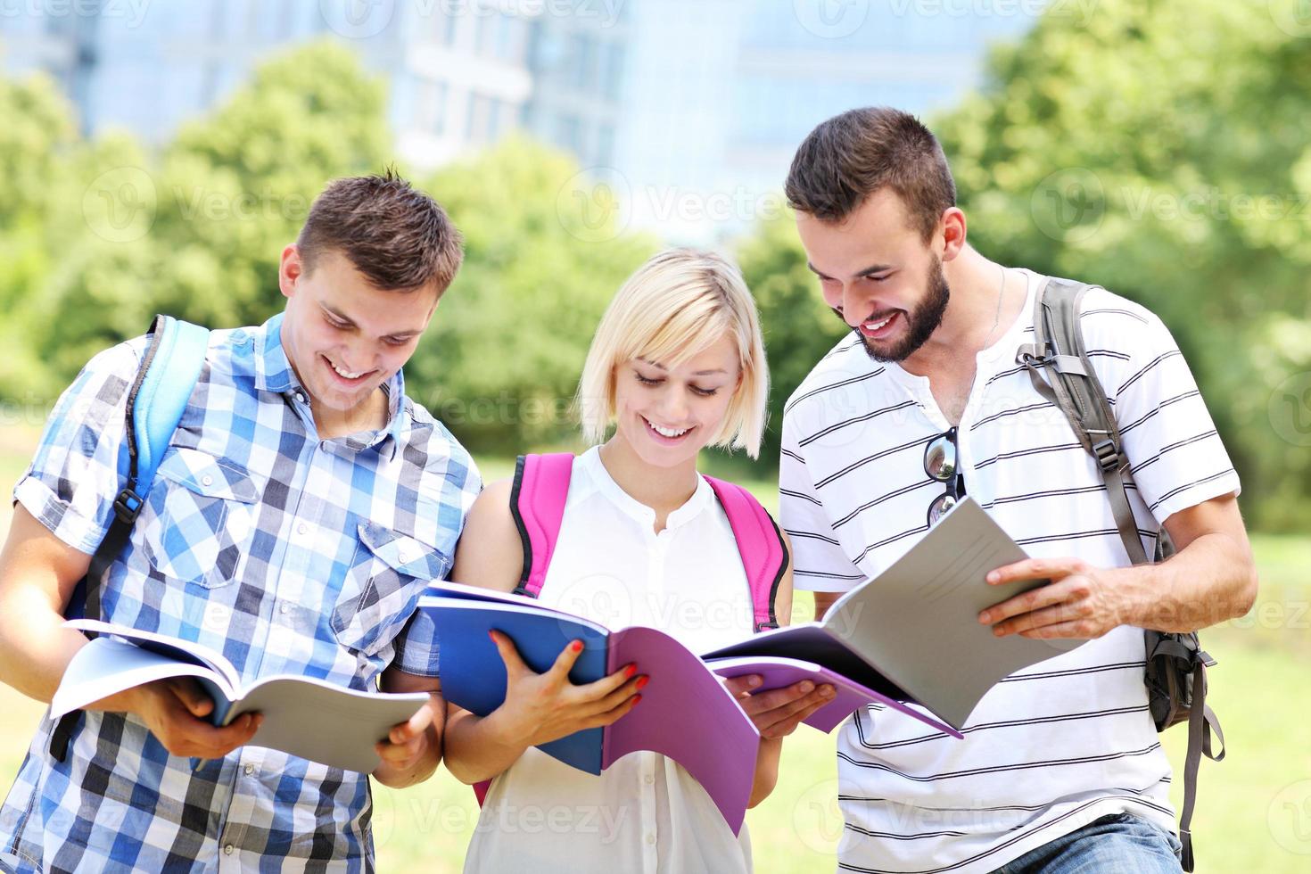 Joyful students learning in the park photo