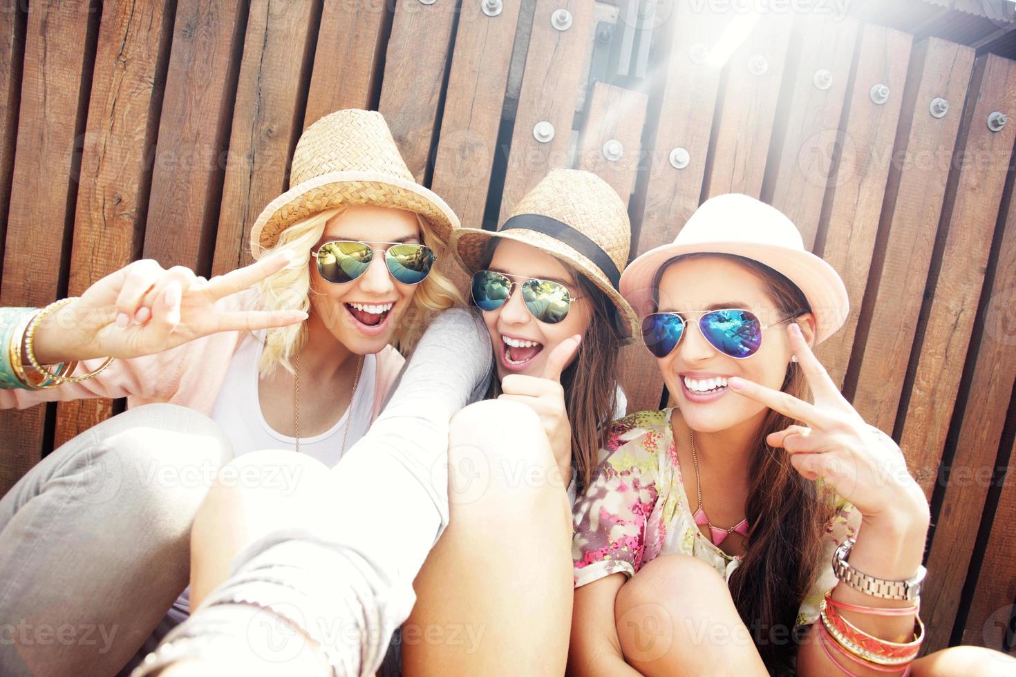 Group of friends taking selfie in the city photo