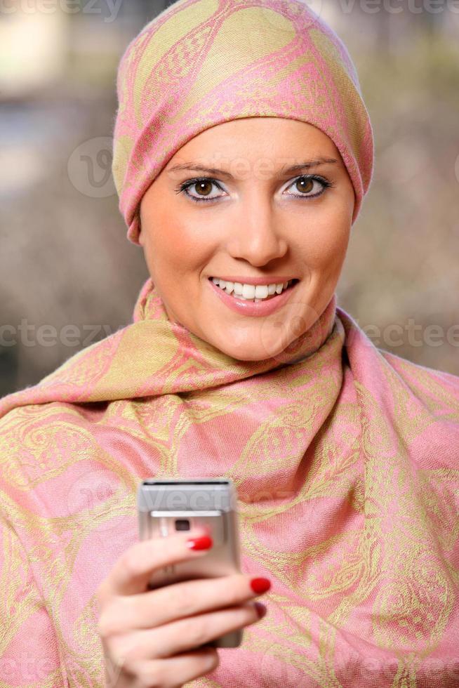 Arabic businesswoman with a cell phone photo