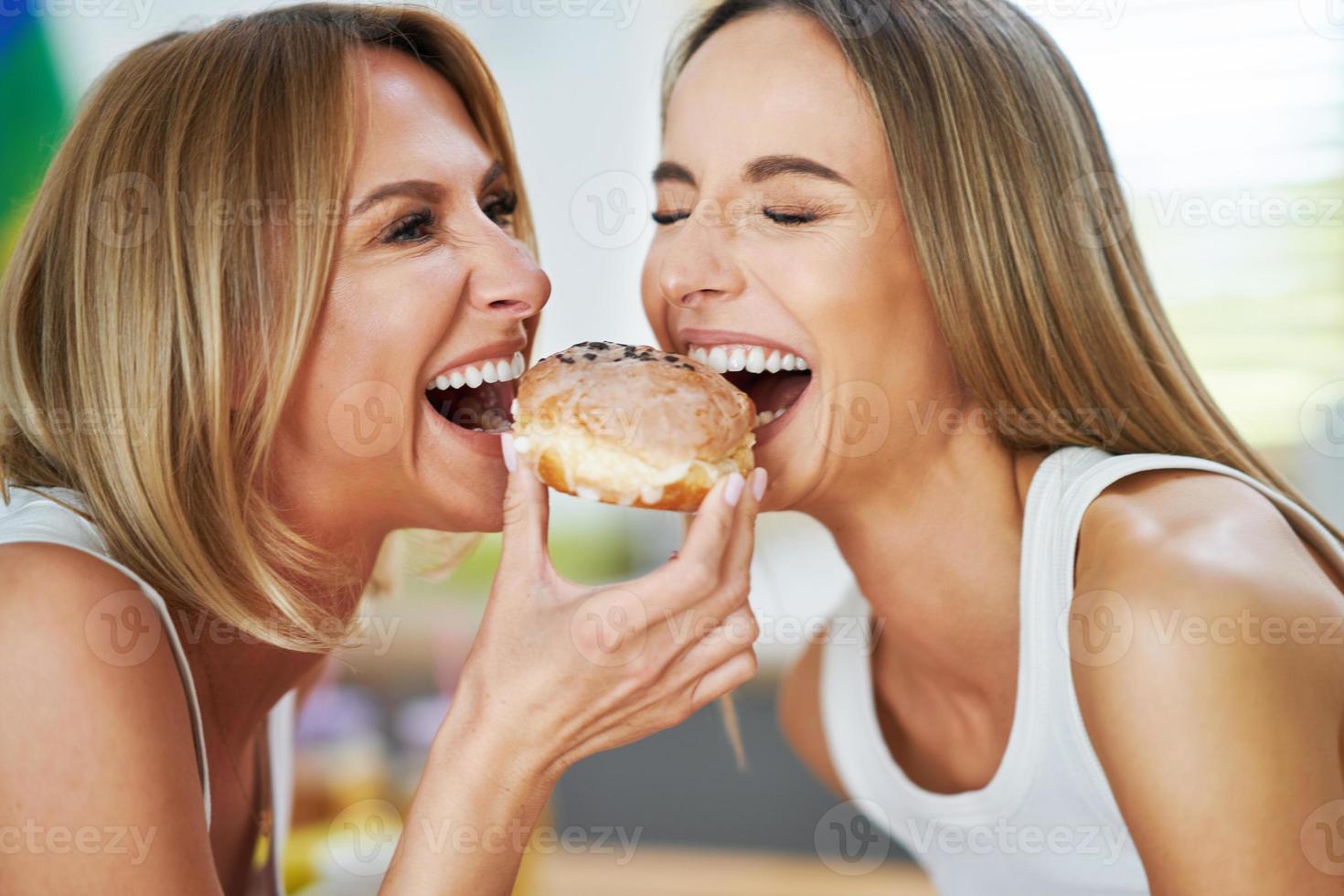 LGBT Lesbian couple love moments in the kitchen happiness concept photo