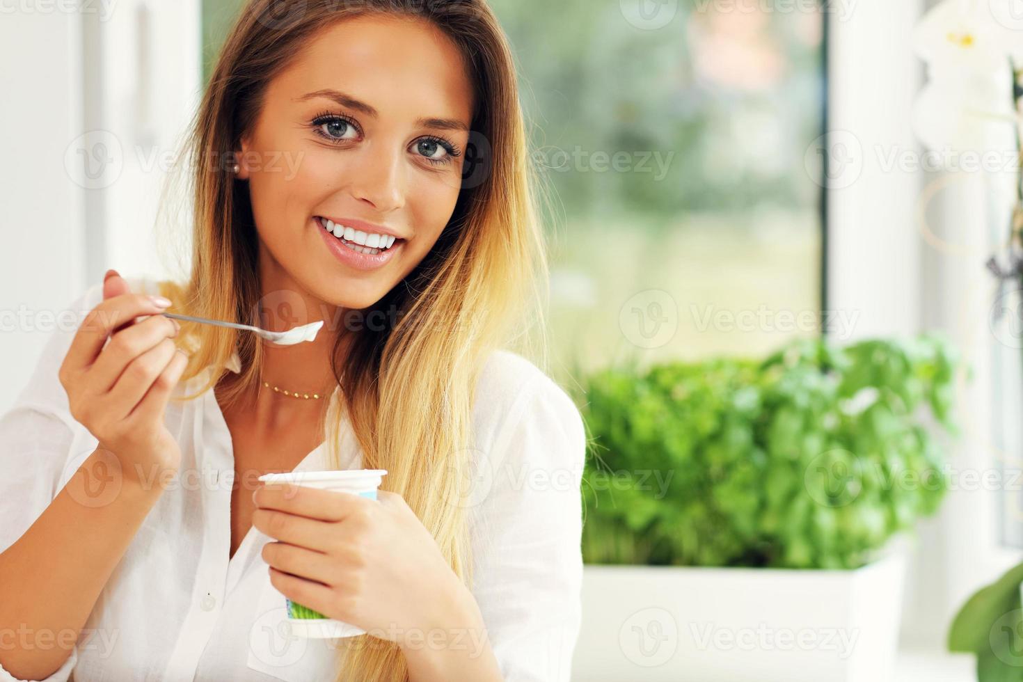 Woman with youghurt photo