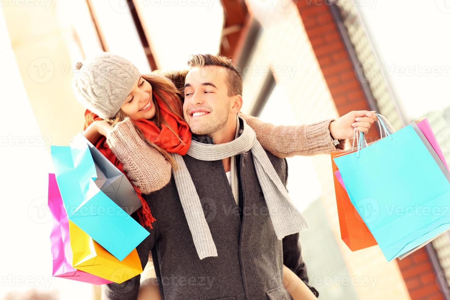 Happy couple shopping in the city photo
