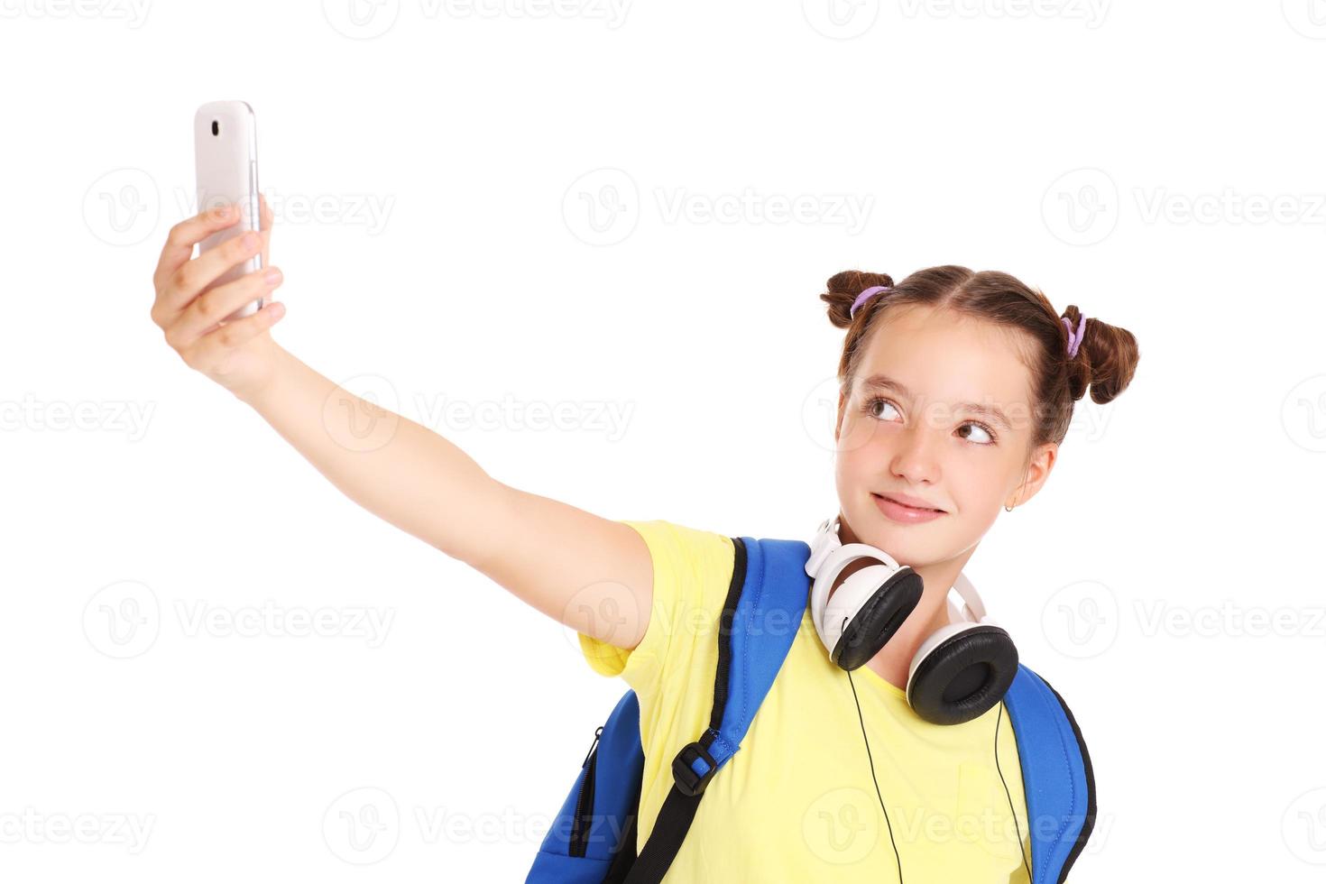 Schoolgirl taking pictures with her smartphone photo