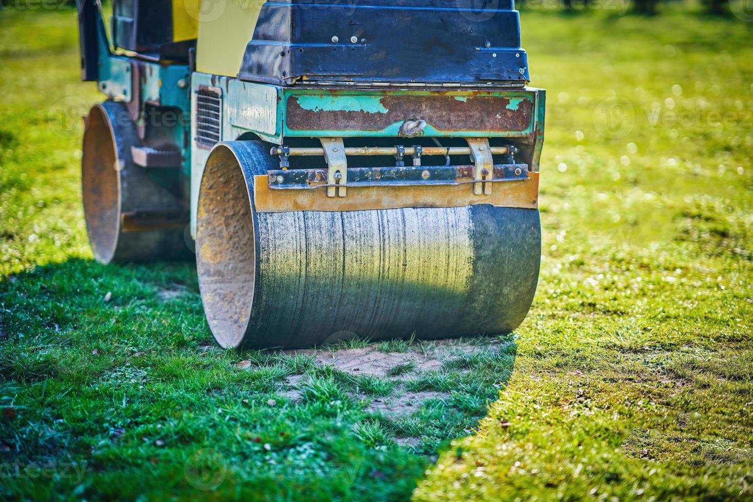 Picture of a road roller machine on the different surfaces photo