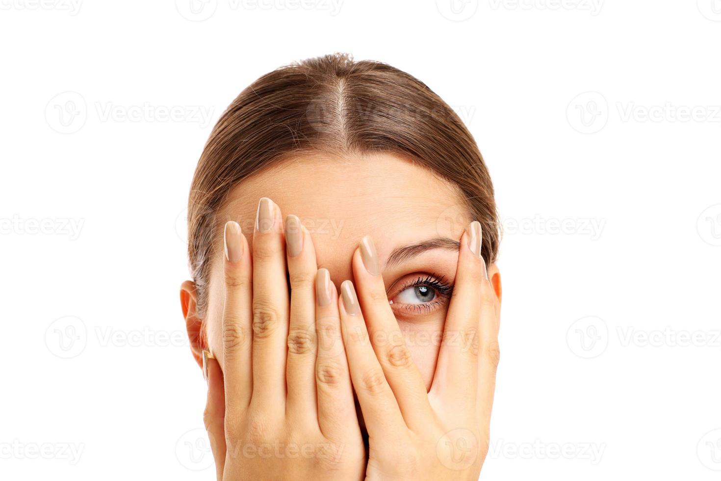 Terrified woman covering her face photo