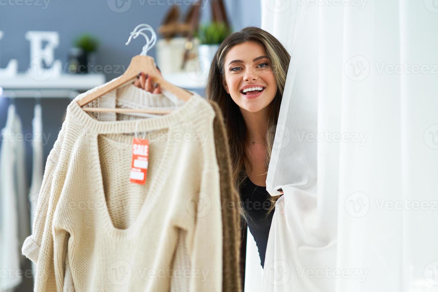 Woman in clothes store in changing room 15895797 Stock Photo at Vecteezy