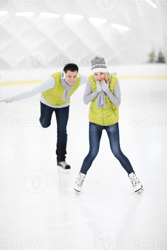 Happy couple in the ice rink photo