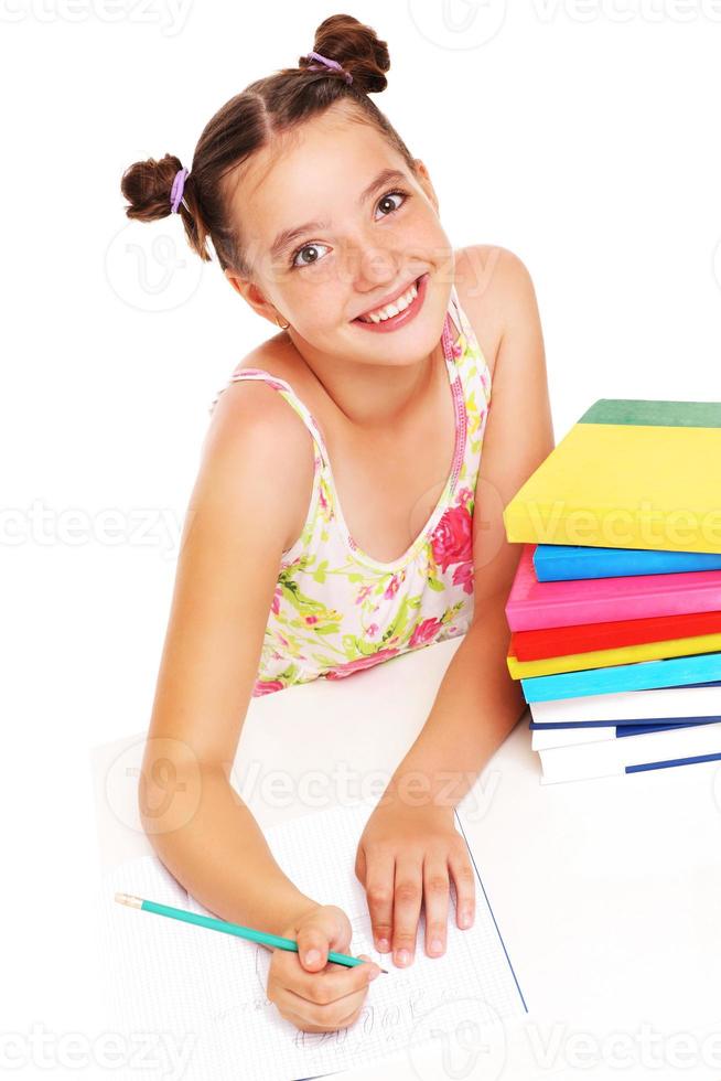 Young girl doing homework photo