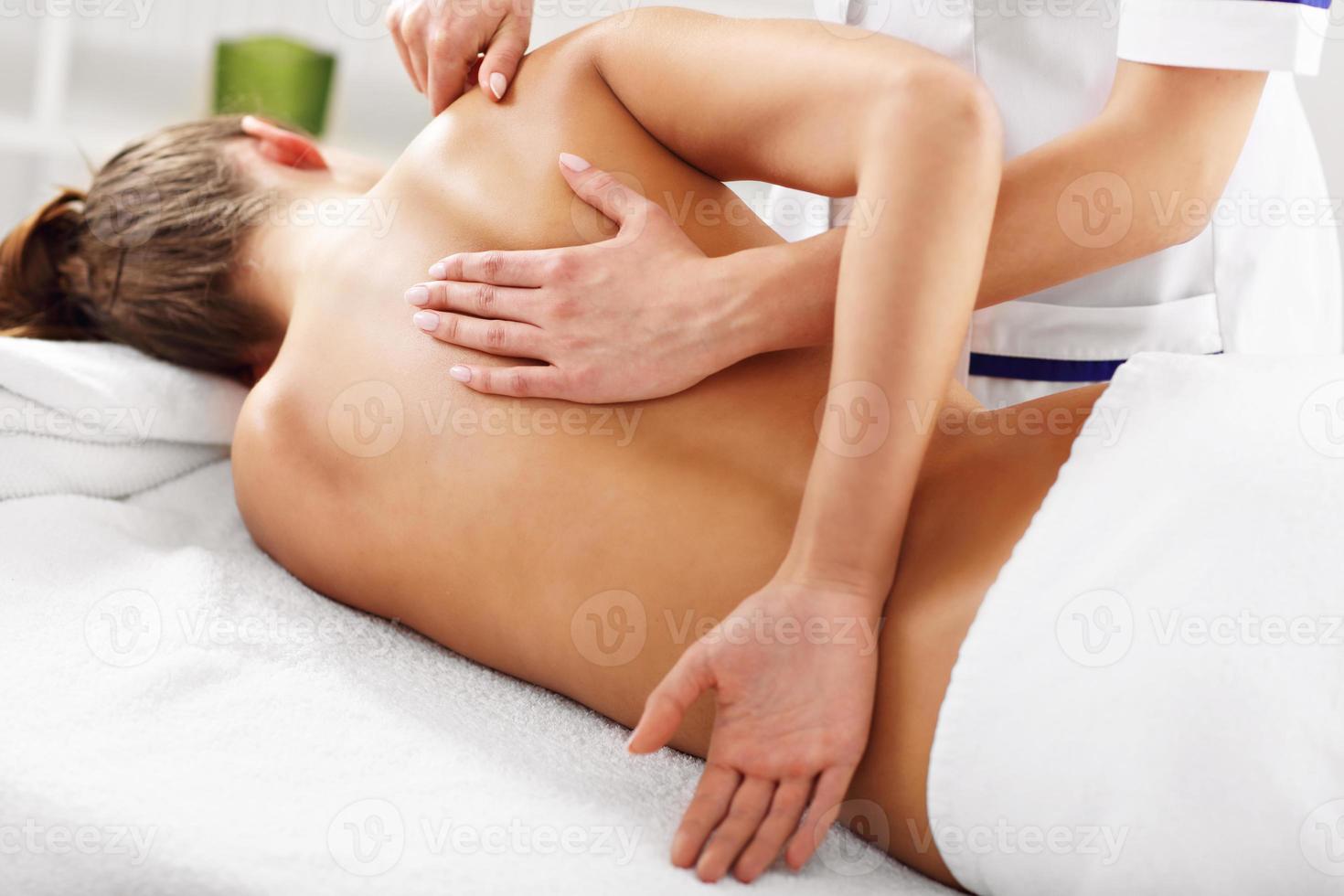 A picture of woman having back therapy photo