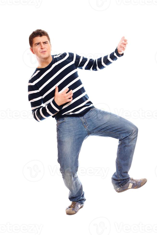 Young man playing on the guitar with a blurry hand photo