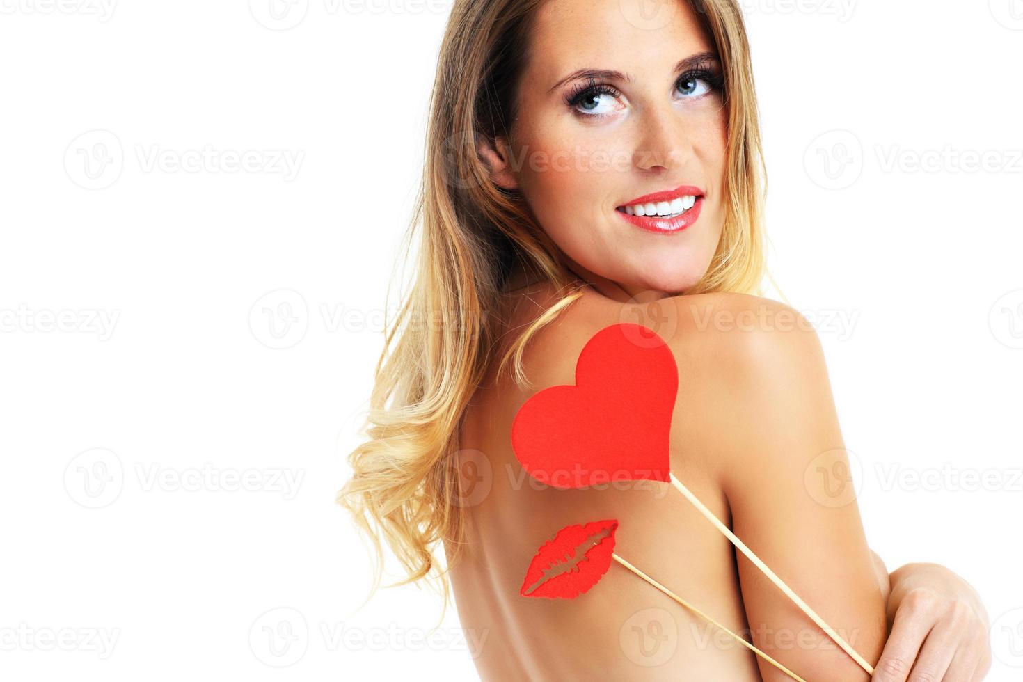 Sexy Valentine woman holding a heart photo