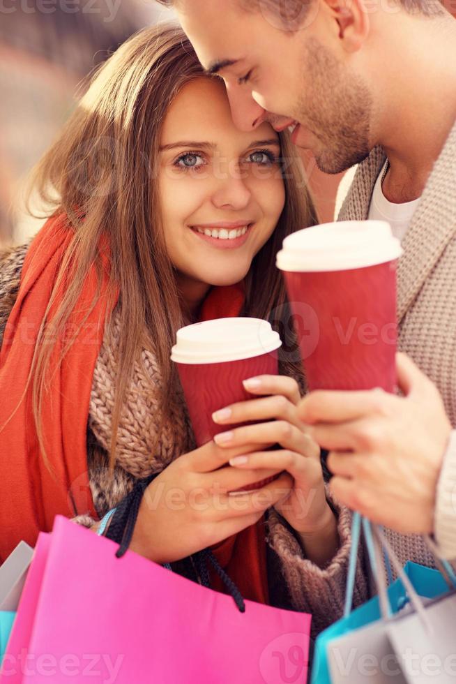 Happy couple with coffee shopping in the mall photo