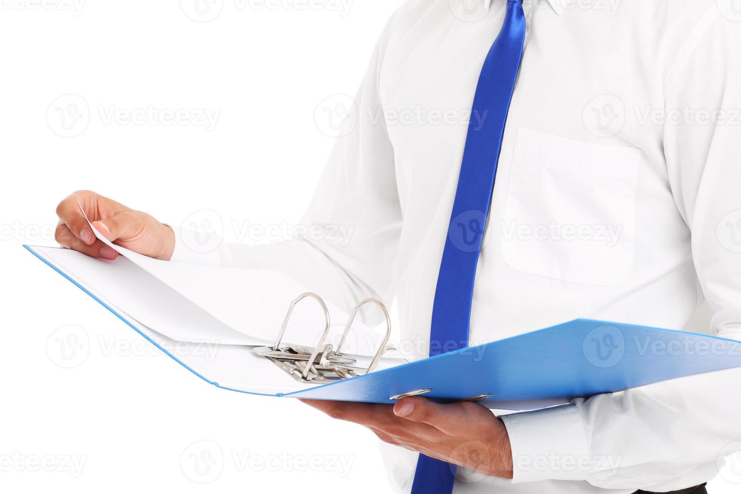 Midsection of a businessman with documents photo