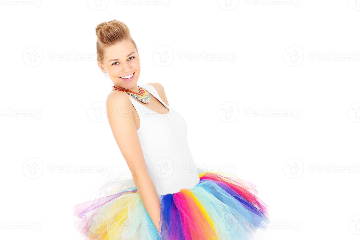 Portrait of a happy woman in a colourful skirt photo