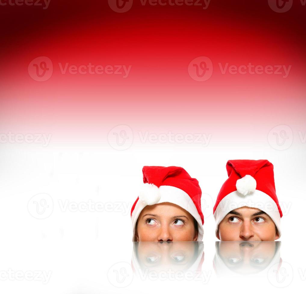 Santas over red background photo