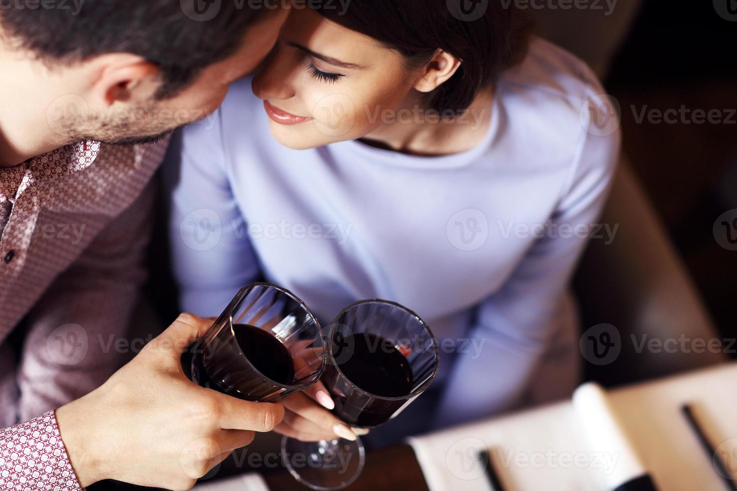 Romantic couple dating in restaurant photo