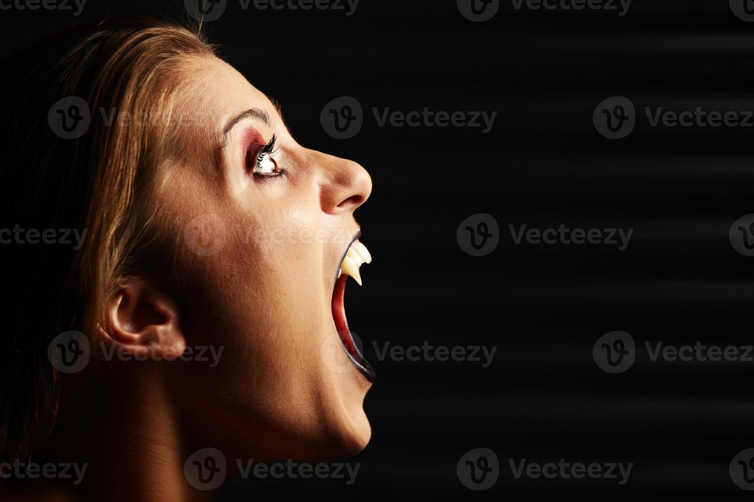 Vampire woman screaming photo