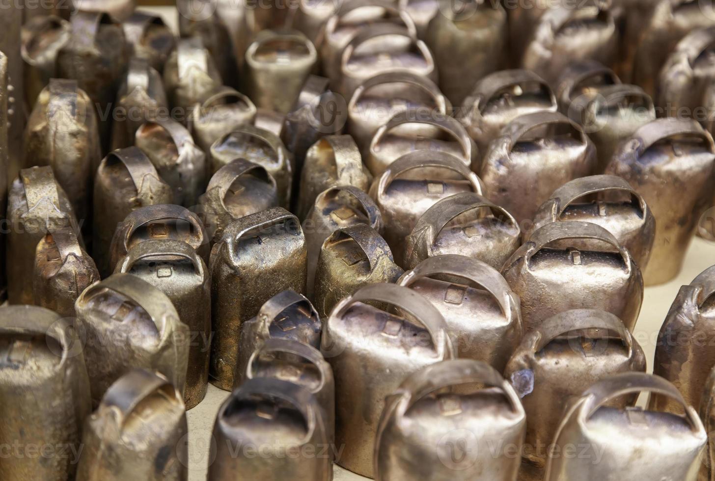 Cow bells in a market photo