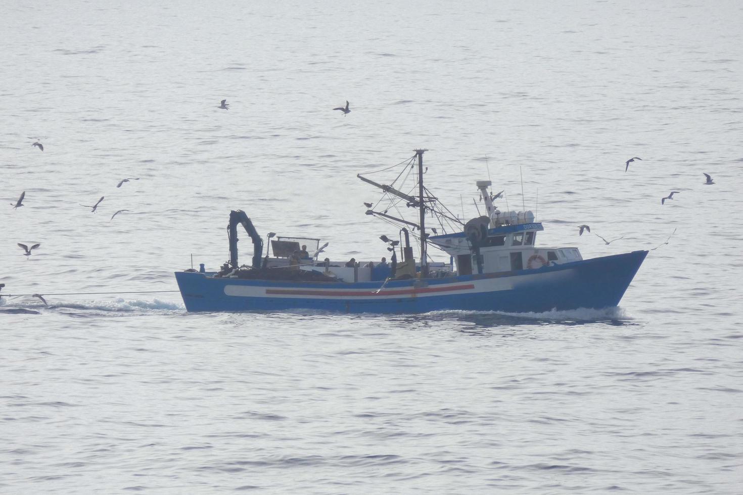 Fishermen returning from fishing at dawn after spending the whole night at sea. photo