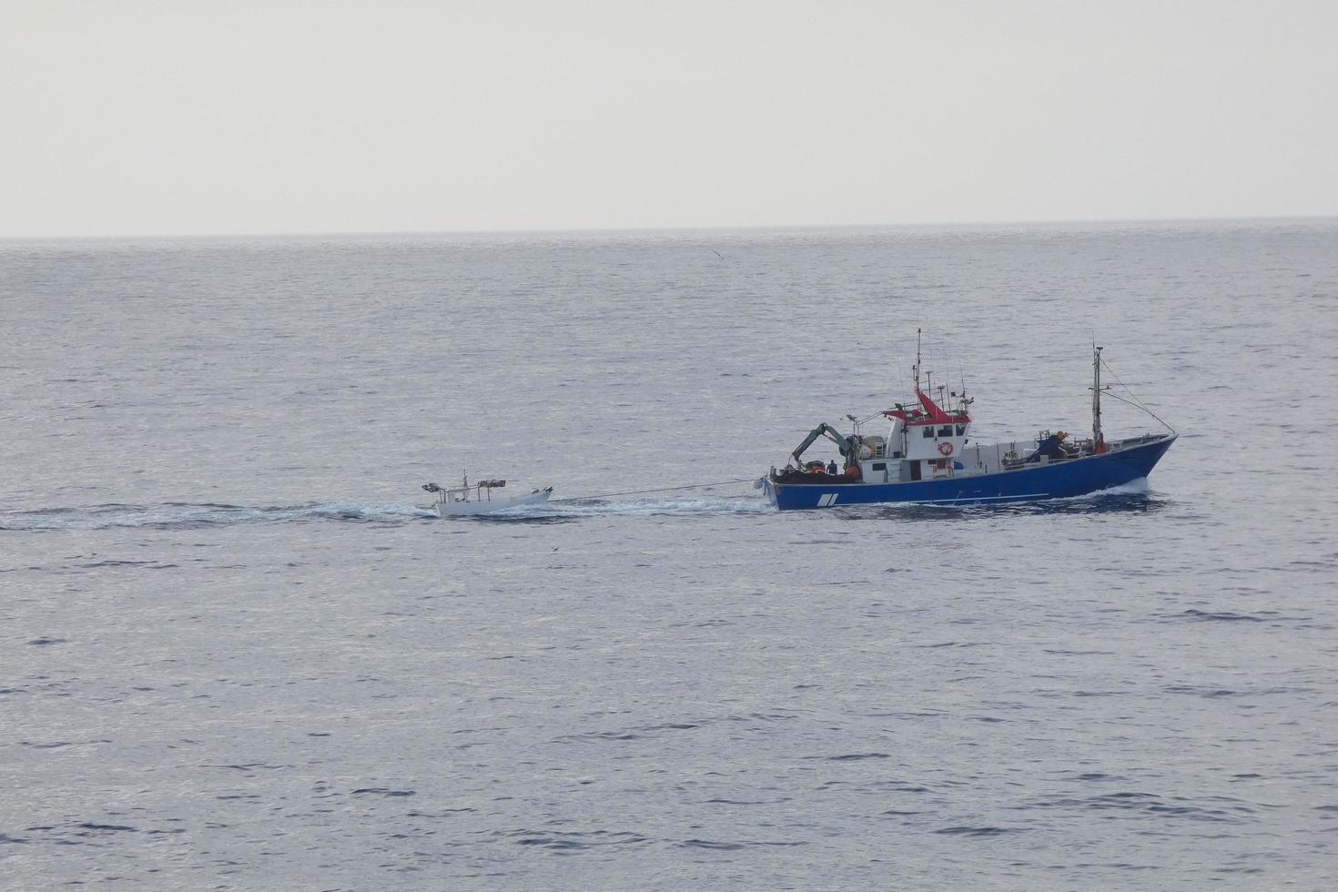 Fishing vessel returning from fishing in the Mediterranean Sea. photo
