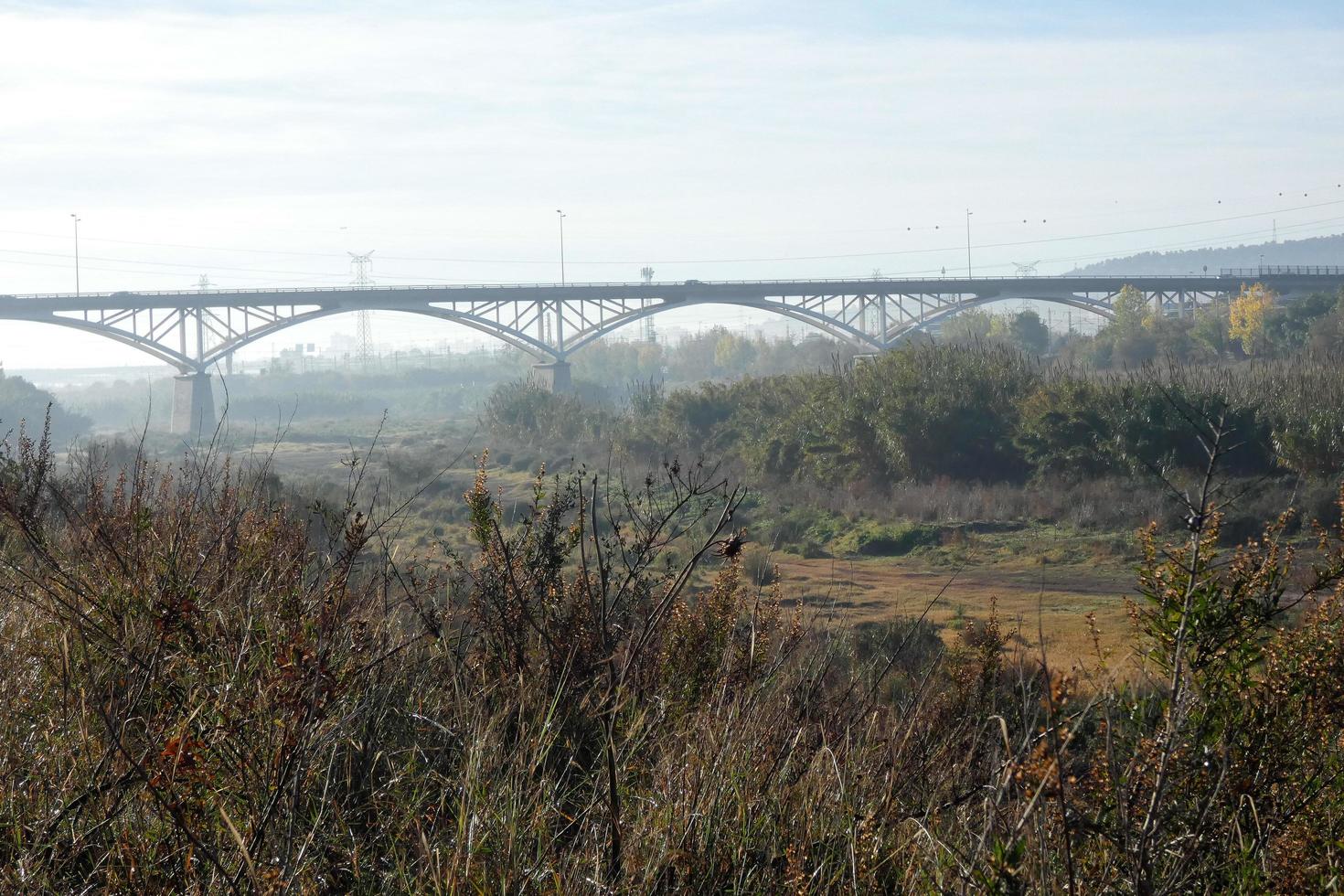 Modern bridge spanning a river, an engineering feat photo