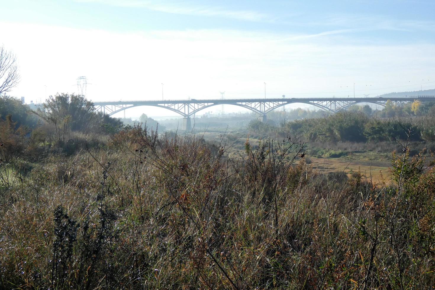 Modern bridge spanning a river, an engineering feat photo