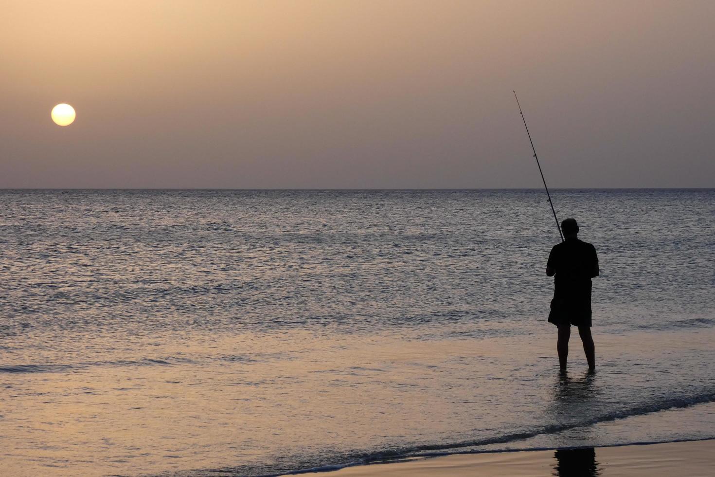 Beach shore fishing, traditional fishing as a hobby photo