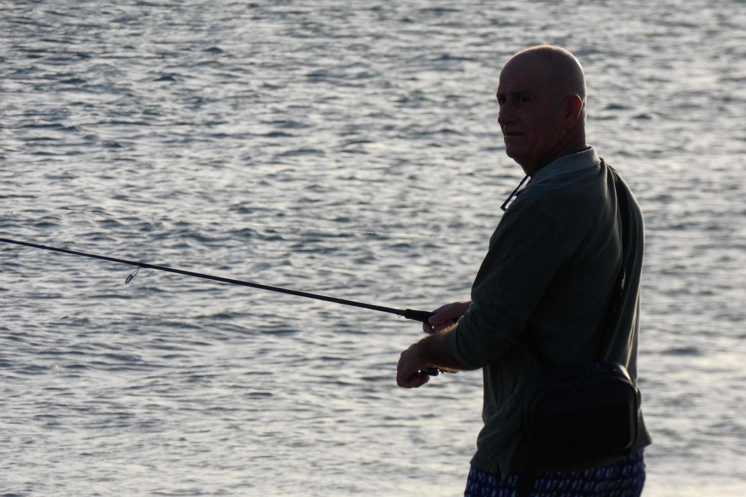 Beach shore fishing, traditional fishing as a hobby photo