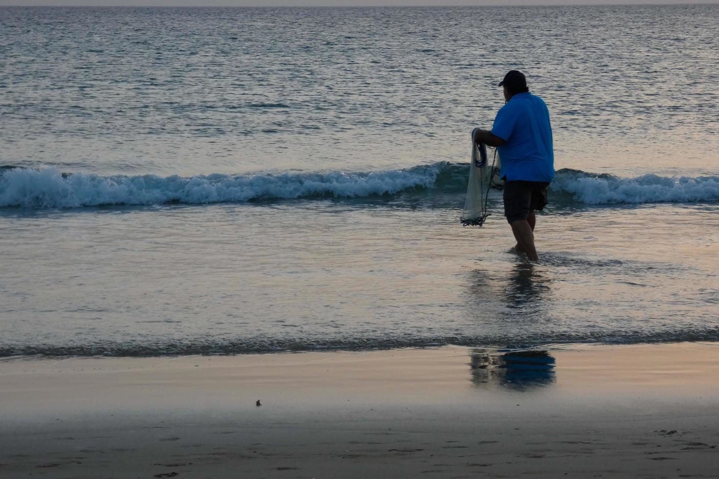 Beach shore fishing, traditional fishing as a hobby photo