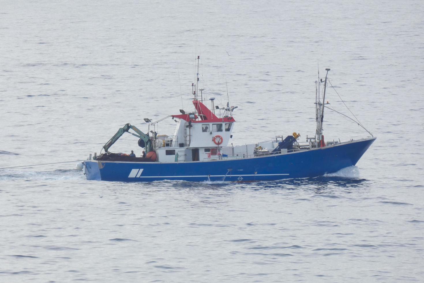 Fishing vessel returning from fishing in the Mediterranean Sea. photo