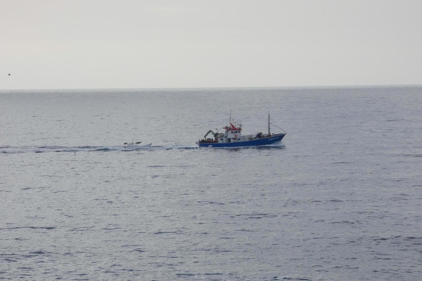 Fishing vessel returning from fishing in the Mediterranean Sea. photo